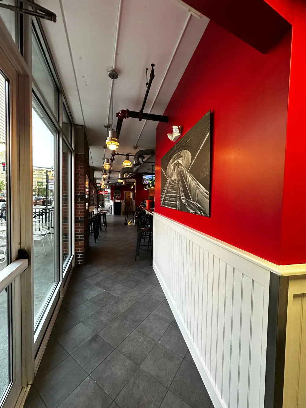 Restaurant corridor with red walls and white wainscoting