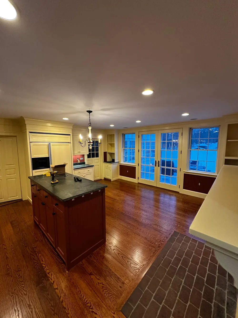 Kitchen and dining area with French doors and painted trim